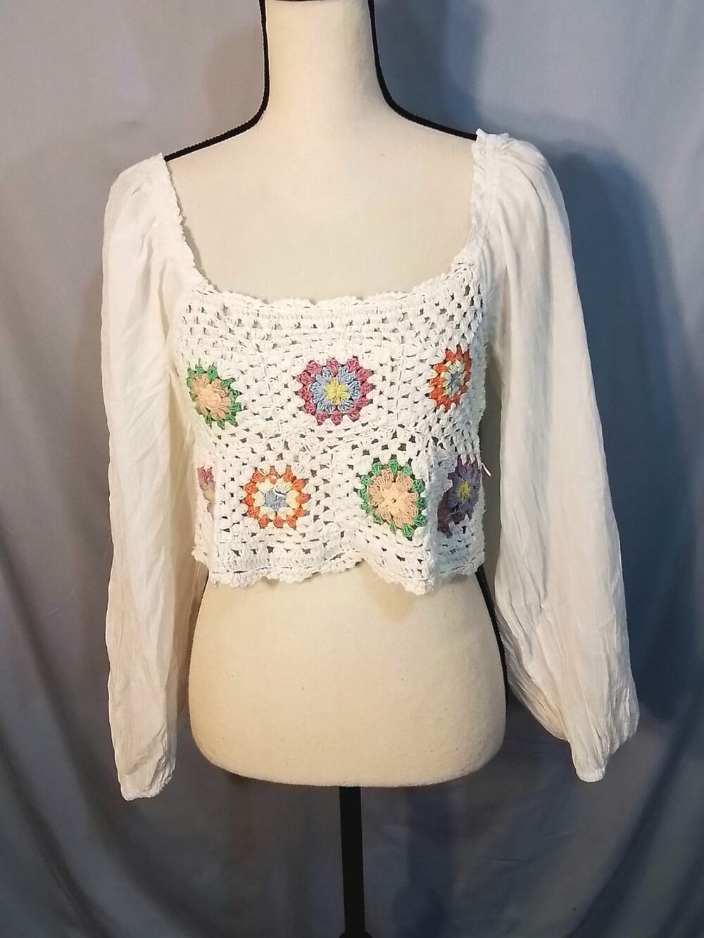 Aerie Crocheted white crop top with long sleeves.
